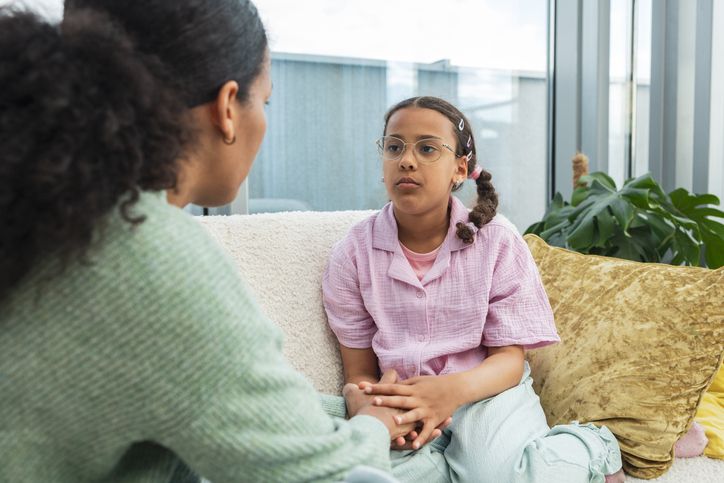 Mother comforting daughter listening to her problems