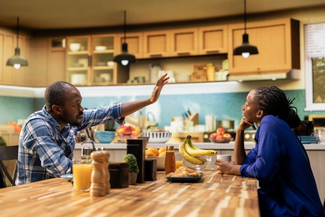 African american guy trying to catch attention of absent zoned out lover