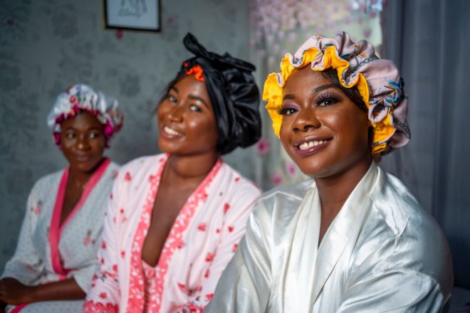 Happy women in dressing gowns and hair bonnets
