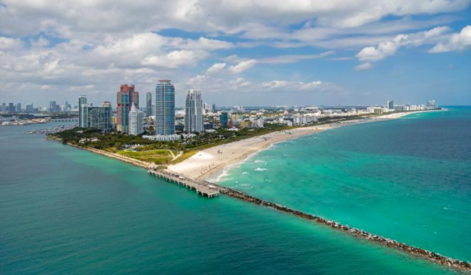 Miami seaside with turquoise ocean and sky. Miami city. Famous oceanfront of Miami. Miami Beach skyline.