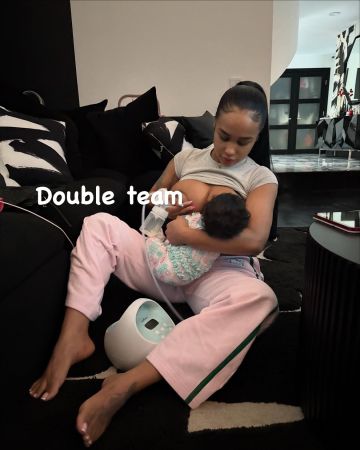 A woman holding and comforting a young child, with the text "Double team" visible in the image.